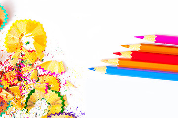 Image showing colored pencils and shavings on white background