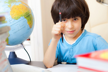 Image showing schoolboy doing homework