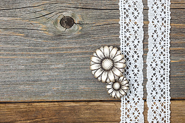 Image showing vintage metal buttons flowers and lace ribbons