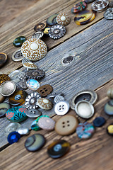 Image showing placer of vintage buttons on aged boards