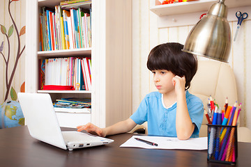 Image showing boy doing homework, portrait