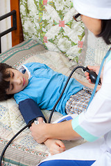 Image showing Doctor pediatrician measure blood pressure