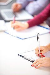 Image showing Woman signing a contract