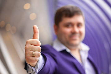 Image showing businessman showing thumbs up