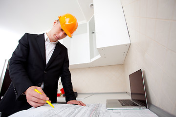 Image showing engineer working with documents