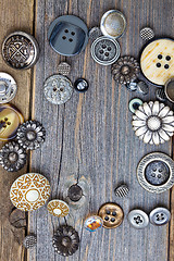 Image showing vintage buttons on old wooden boards