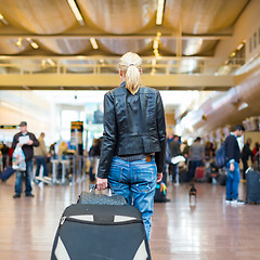 Image showing Female traveller walking airport terminal.