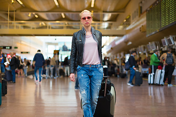 Image showing Female traveller walking airport terminal.