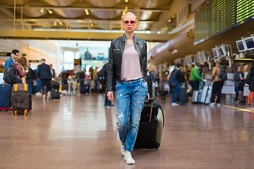 Image showing Female traveller walking airport terminal.