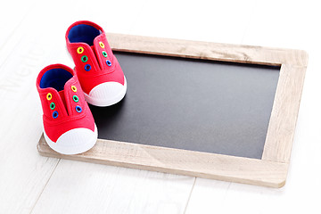 Image showing frame and baby shoes