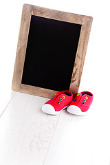 Image showing frame and baby shoes