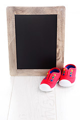 Image showing frame and baby shoes