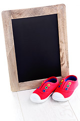 Image showing frame and baby shoes