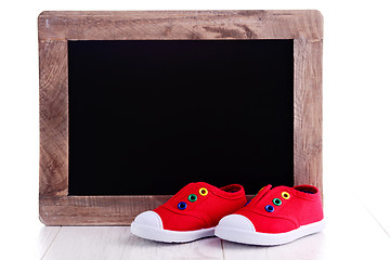 Image showing frame and baby shoes