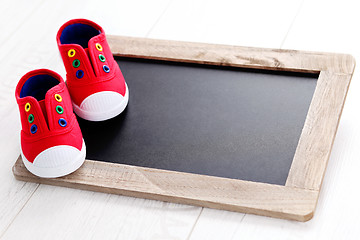 Image showing frame and baby shoes