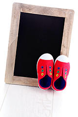 Image showing frame and baby shoes