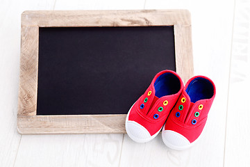 Image showing frame and baby shoes