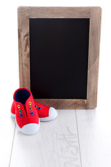 Image showing frame and baby shoes