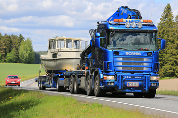 Image showing Scania 124 Truck Hauls a Boat 