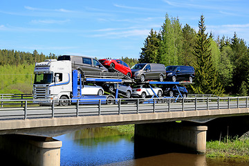Image showing Scania R480 Auto Carrier Hauls New Cars on Bridge