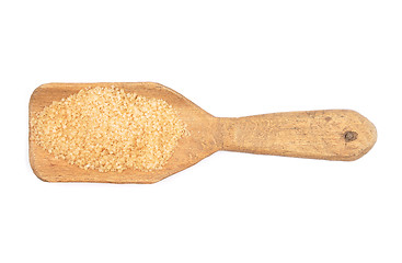 Image showing Brown cane sugar on shovel