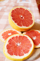 Image showing fresh sliced grapefruit on the table
