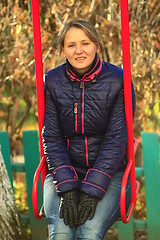 Image showing modern woman goes for a drive on the swing