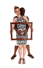 Image showing Pregnant couple with picture frame.