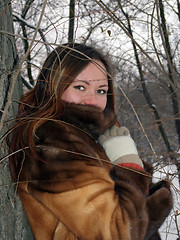 Image showing The beautiful girl in the winter in park 4