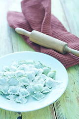 Image showing flour and raw ravioli 