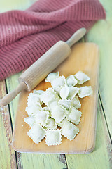 Image showing flour and raw ravioli 