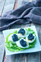 Image showing boiled eggs with caviar