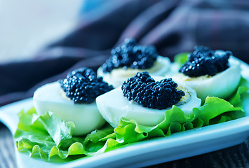 Image showing boiled eggs with caviar