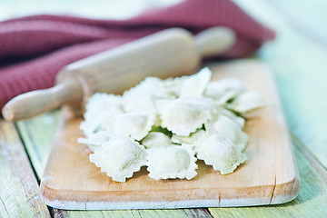 Image showing flour and raw ravioli 