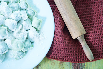 Image showing flour and raw ravioli 