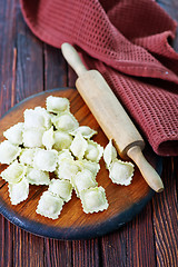 Image showing flour and raw ravioli 