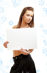 Image showing girl holding blank sign board with snowflakes