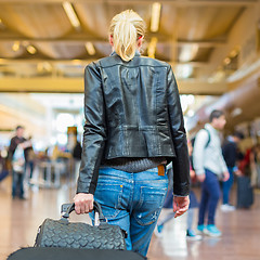 Image showing Female traveller walking airport terminal.