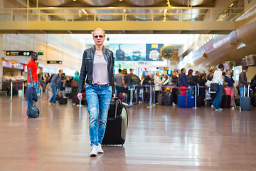 Image showing Female traveller walking airport terminal.