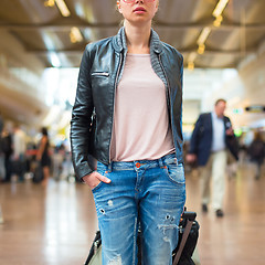 Image showing Female traveller walking airport terminal.