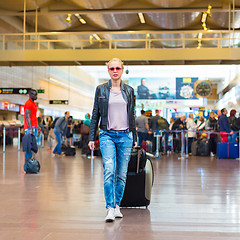 Image showing Female traveller walking airport terminal.