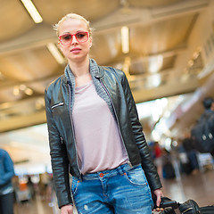 Image showing Female traveller walking airport terminal.