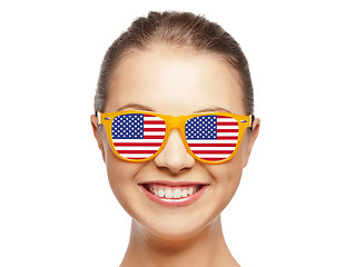 Image showing happy teenage girl in shades with american flag