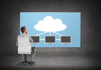 Image showing businessman in office chair over cloud server