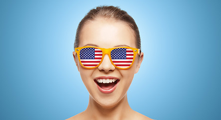 Image showing happy teenage girl in shades with american flag