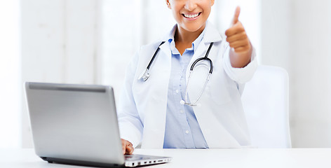 Image showing female doctor with laptop pc