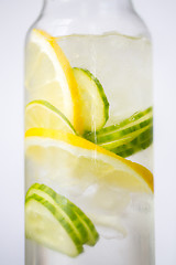 Image showing close up of fruit water in glass bottle