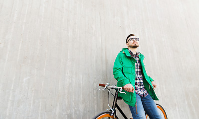 Image showing happy young hipster man with fixed gear bike