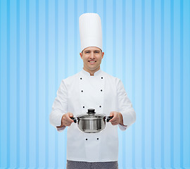 Image showing happy male chef cook holding pot