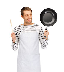 Image showing happy man or cook in apron with pan and spoon